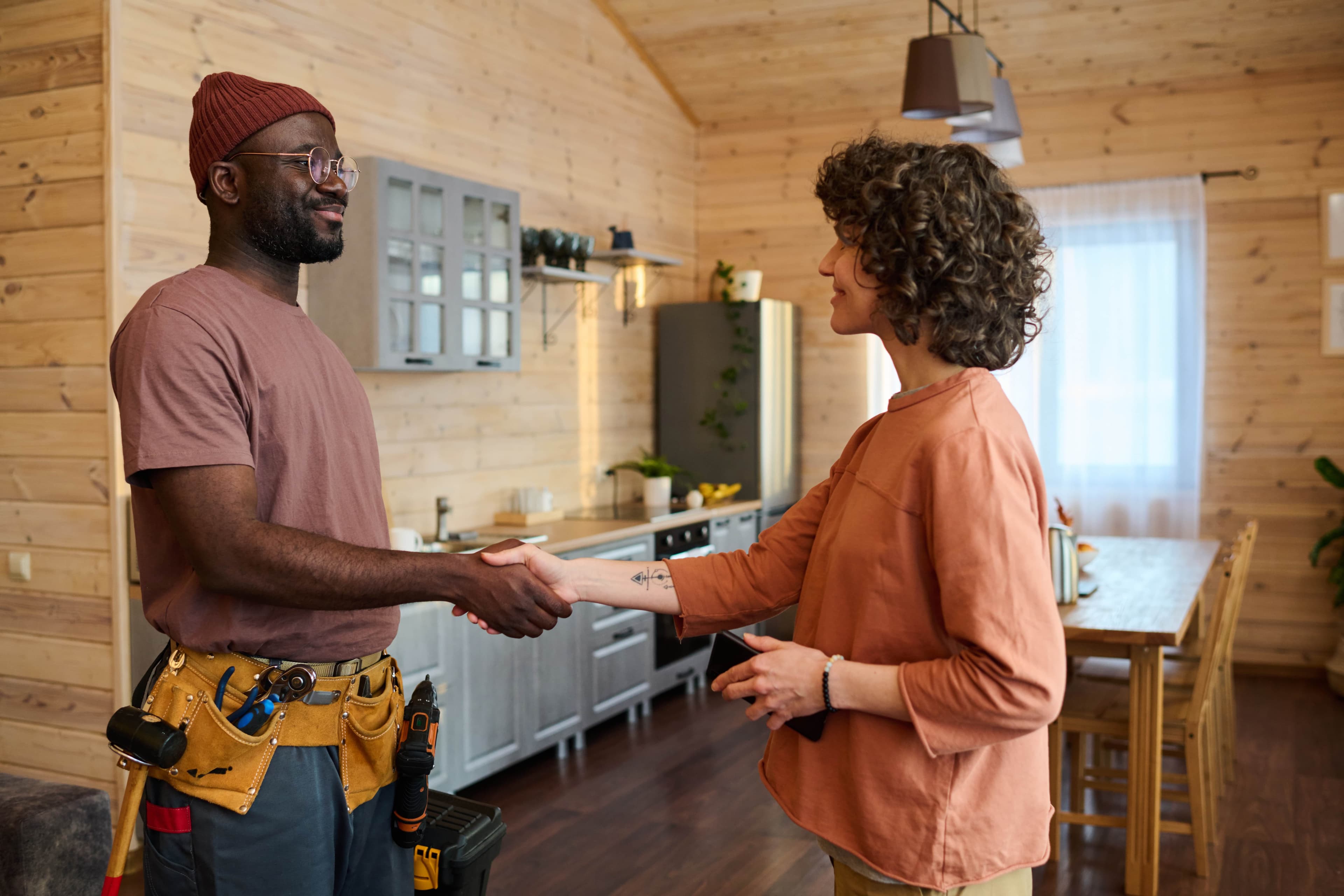 Worker shaking hands with customer